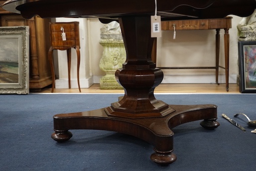 An early Victorian mahogany circular tilt top breakfast table, on octagonal column, diameter 136cm, height 74cm